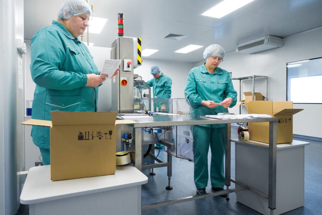 pharmaceutical-technicians-work-sterile-working-conditions-pharmaceutical-factory-scientists-wearing-protective-clothing-Gratia- Pharma-solutions-by-luomnt-digital-marketing-agency.